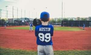 a boy plays baseball