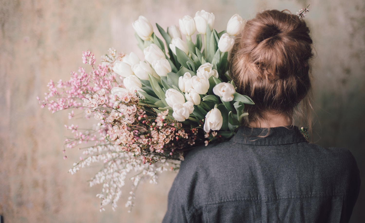 a sensitive introvert carrying flowers says no