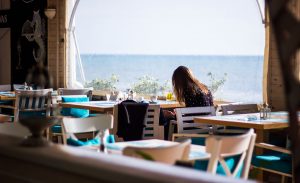 an introvert eats alone in a restaurant
