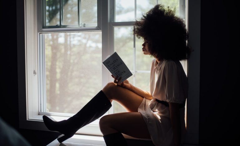 an introvert enjoys reading a book about an introverted character