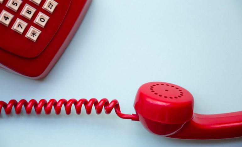 a red telephone represents telephonophobia, the fear of talking on the phone