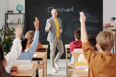 A man teaches in a classroom