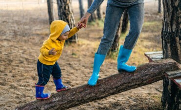 A quiet introverted parent takes a walk with her son