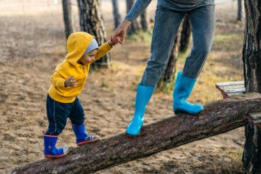 A quiet introverted parent takes a walk with her son