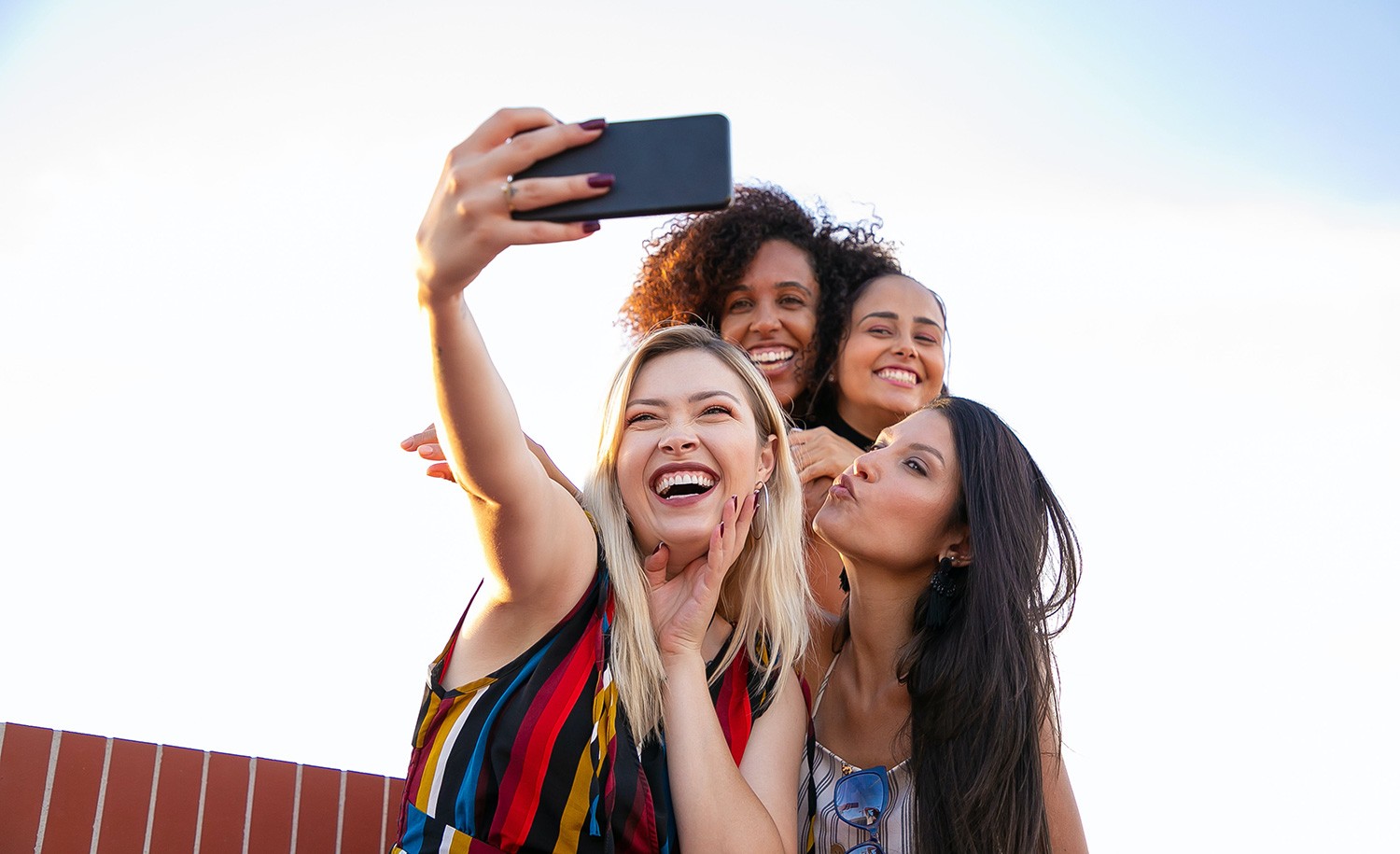 An extroverted introvert takes a selfie with her friends