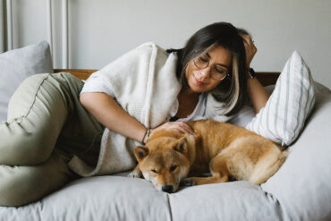 An introvert maximizes her energy by relaxing with her dog