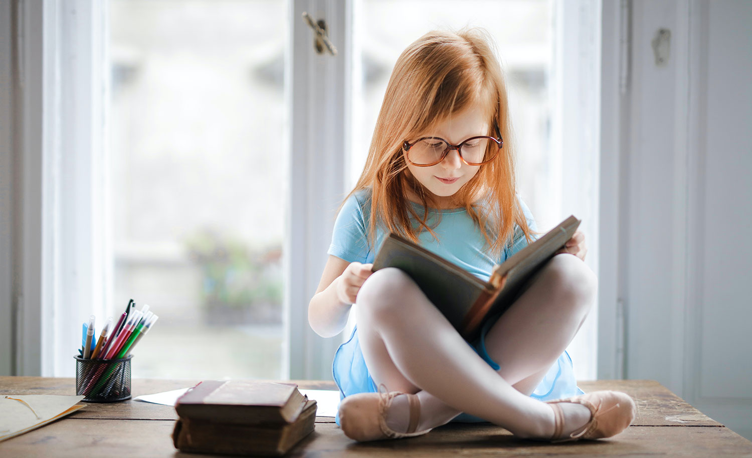 An introverted child reads a book