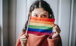 A highly sensitive introvert hides behind a pride flag