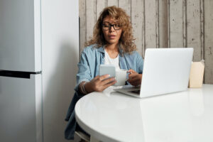 An introvert job hunting on her laptop